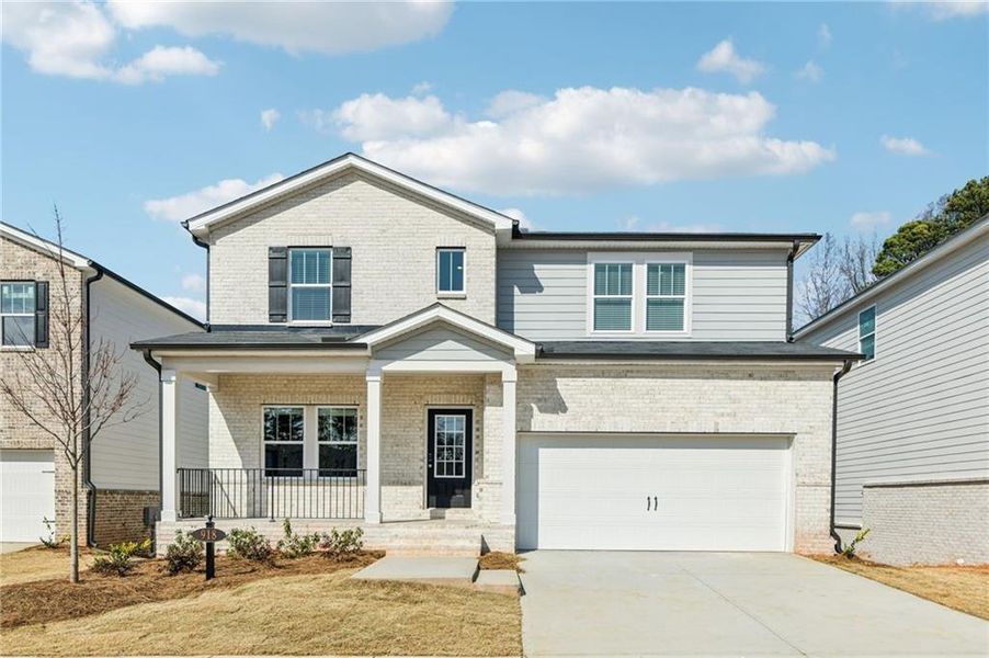 Front exterior of a new home in Martin Springs - Estate Series, Lawrenceville, GA, highlighting curb appeal (Image 1). Front exterior of a new home in Martin Springs - Estate Series, Lawrenceville, GA, highlighting curb appeal (Image 1).