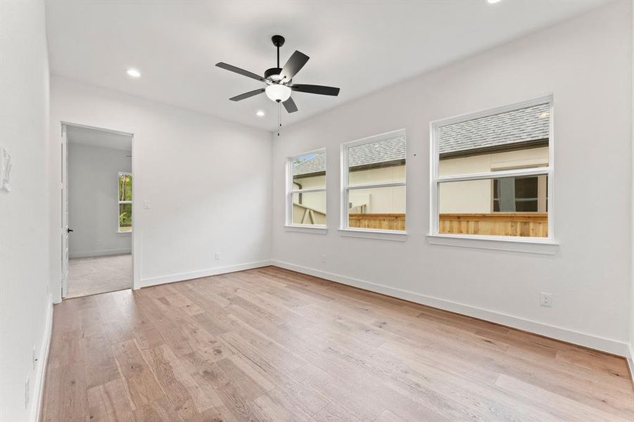 Game Room with Engineered Hardwood Flooring and Fan