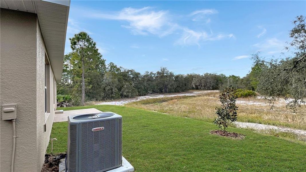 Exterior details and patio area of a home in Poinciana - Polk County, Poinciana (Image 3).