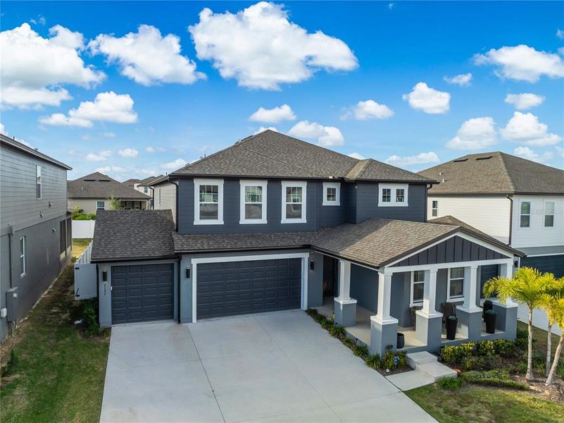 Front exterior of a new home in , Minneola, FL, highlighting curb appeal (Image 1). Front exterior of a new home in , Minneola, FL, highlighting curb appeal (Image 1).