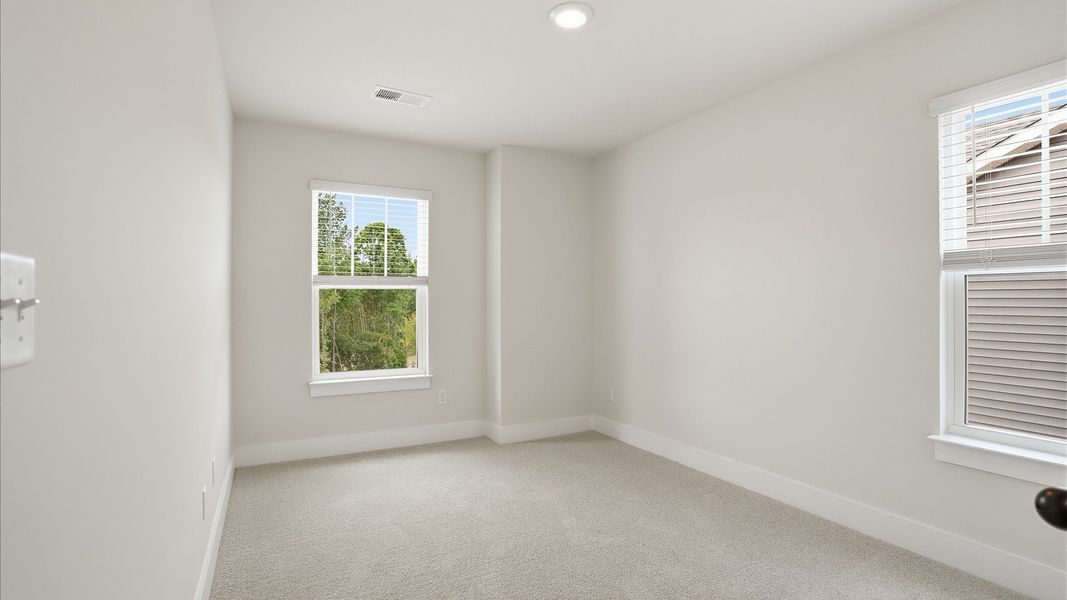 Inviting bedroom with tasteful finishes and large windows that create a fresh, open ambiance at the Marion Square community Inviting bedroom with tasteful finishes and large windows that create a fresh, open ambiance at the Marion Square community