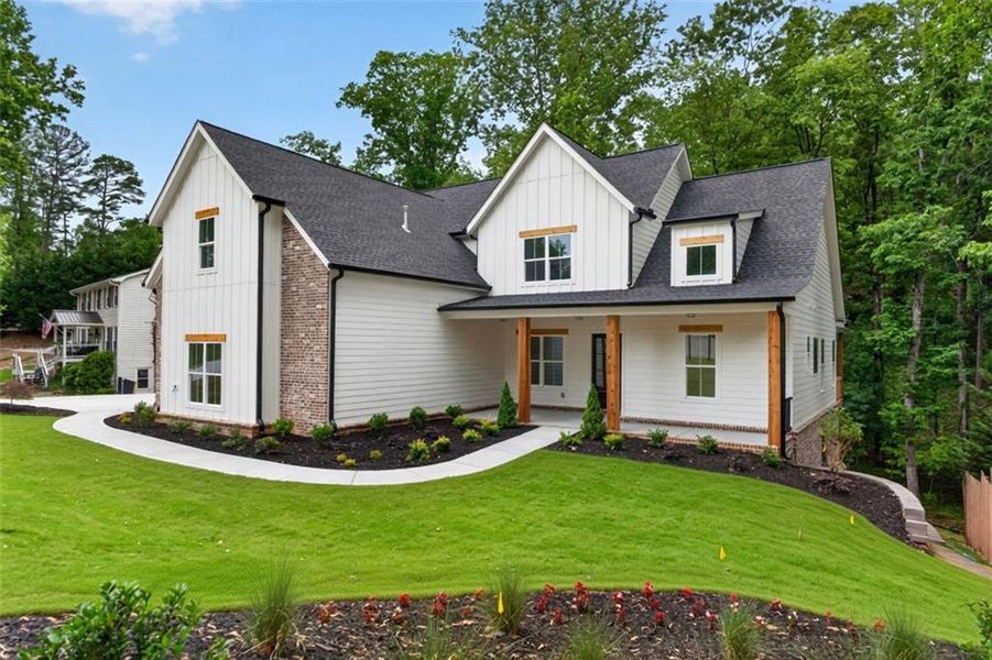 Front exterior of a new home in , Cumming, GA, highlighting curb appeal (Image 2).