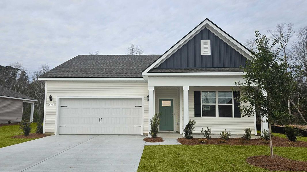 Front exterior of a new home in Pinewood Estates, Conway, SC, highlighting curb appeal (Image 1). Front exterior of a new home in Pinewood Estates, Conway, SC, highlighting curb appeal (Image 1).