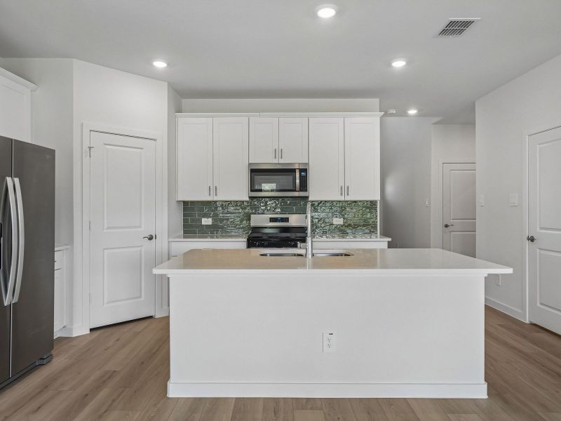 Furnished interior view inside a new home in Parks at Foster Crossing - Signature Series, Anna (Image 6).