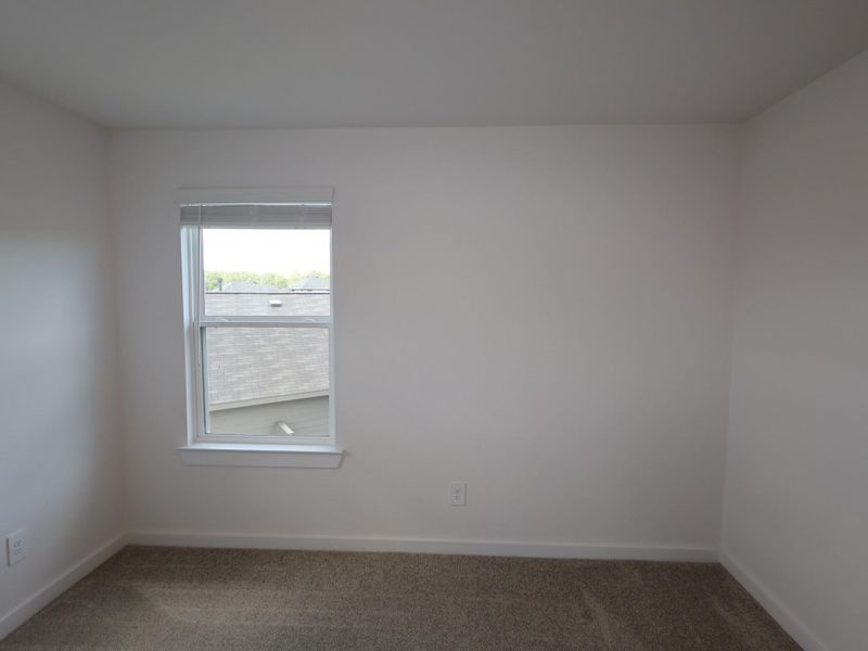 Spacious, unfurnished interior of a new home in Pinewood at Grand Texas, New Caney (Image 29).