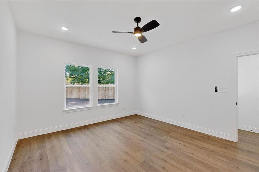 Unfurnished room featuring light wood finished floors, recessed lighting, and a ceiling fan