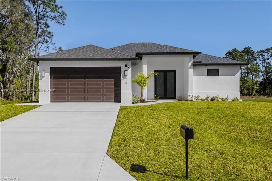 Front exterior of a new home in , Lehigh Acres, FL, highlighting curb appeal (Image 1).