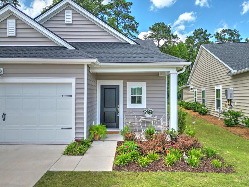 Exterior details and patio area of a home in Horizons at Summers Corner | 55+, Summerville (Image 28).