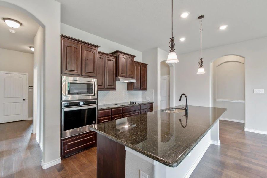 Kitchen | Concept 2671 at Mockingbird Hills in Joshua, TX by Landsea Homes