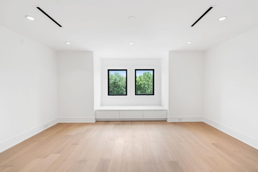 Third story bedroom with cozy reading nook and abundance of space.