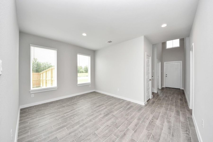 Craft enduring memories with loved ones around the table! This roomy dining area boasts stylish flooring, personalized paint, and is conveniently situated next to the family room and kitchen, fostering an open and inclusive ambiance. Sample photo of completed home with similar floor plan. Actual colors and selections may vary. Craft enduring memories with loved ones around the table! This roomy dining area boasts stylish flooring, personalized paint, and is conveniently situated next to the family room and kitchen, fostering an open and inclusive ambiance. Sample photo of completed home with similar floor plan. Actual colors and selections may vary.