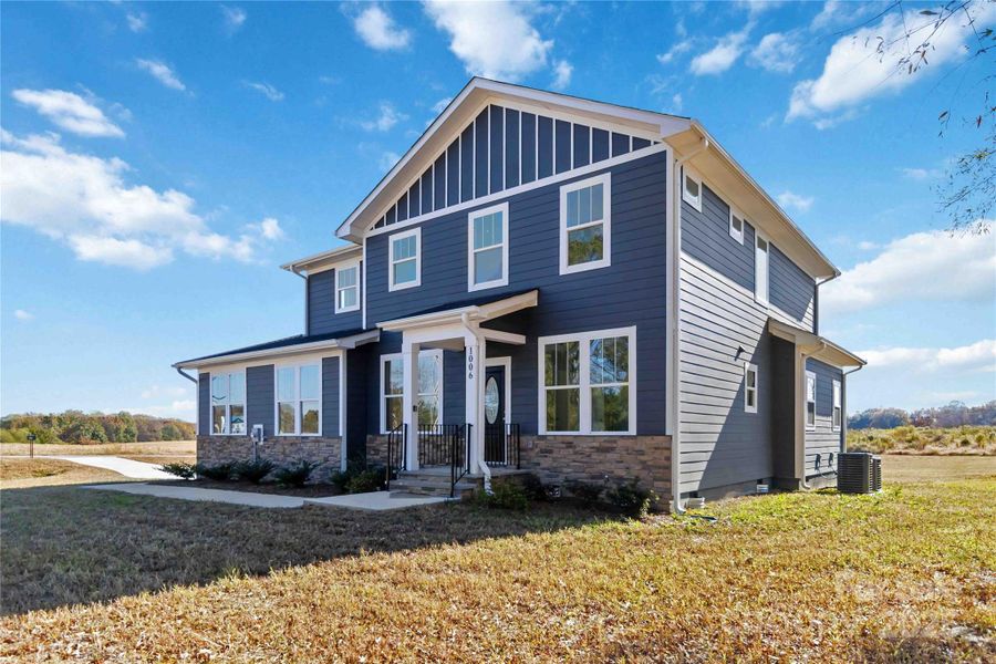 Front exterior of a new home in , Monroe, NC, highlighting curb appeal (Image 23). Front exterior of a new home in , Monroe, NC, highlighting curb appeal (Image 23).