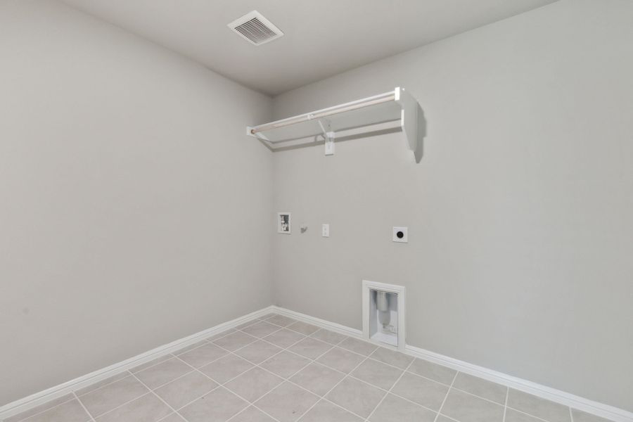 Utility Room in the Harrison home plan by Trophy Signature Homes – REPRESENTATIVE PHOTO