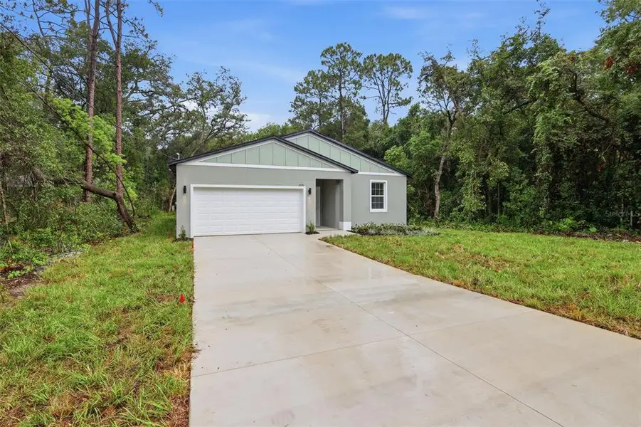 Front exterior of a new home in , Mount Plymouth, FL, highlighting curb appeal (Image 1). Front exterior of a new home in , Mount Plymouth, FL, highlighting curb appeal (Image 1).