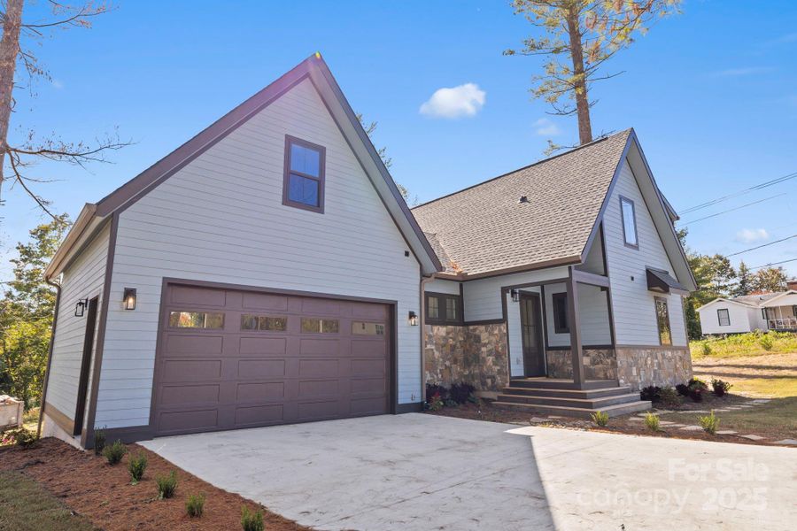 Front exterior of a new home in , Hendersonville, NC, highlighting curb appeal (Image 16).