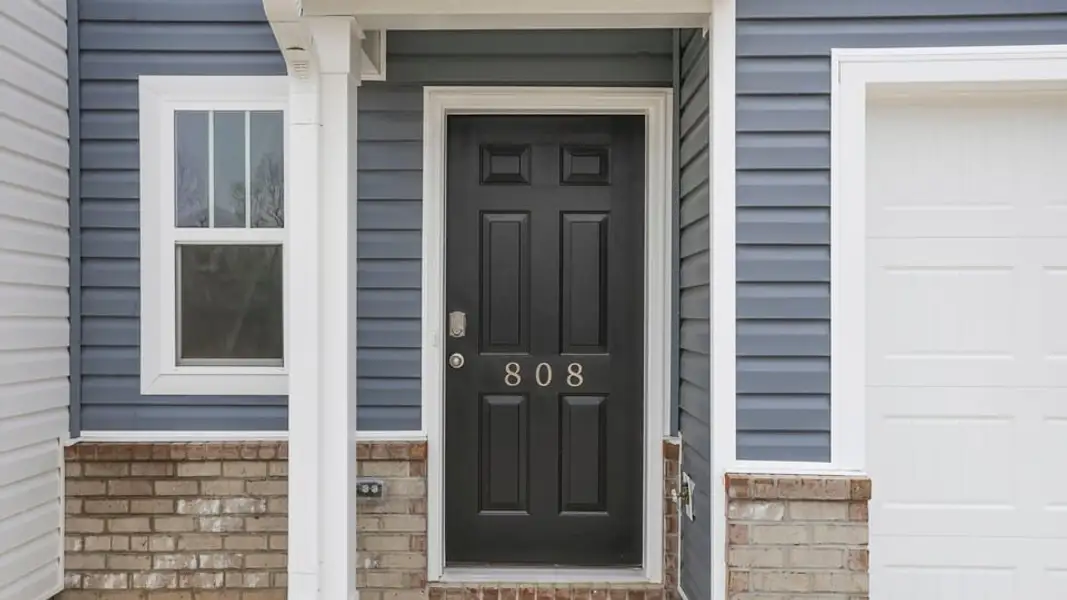 Exterior details and patio area of a home in Covington Village, Greer (Image 4).