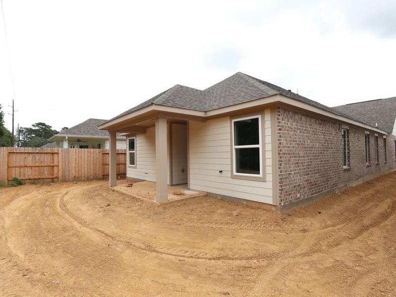 Front exterior of a new home in Sorella, Tomball, TX, highlighting curb appeal (Image 17). Front exterior of a new home in Sorella, Tomball, TX, highlighting curb appeal (Image 17).