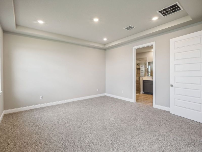 Primary Bedroom in the Onyx floorplan at 6406 NW Sweetwood Drive