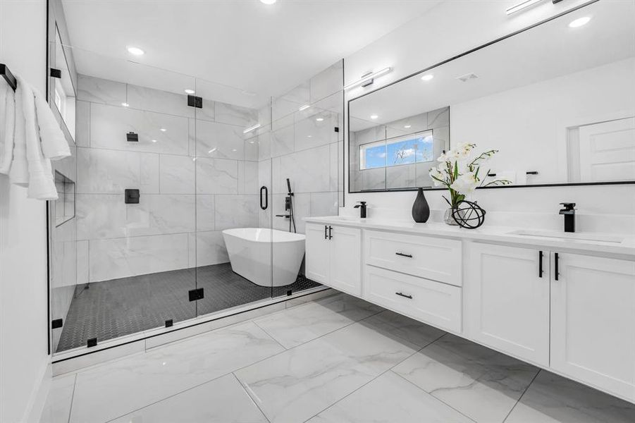 Bathroom with vanity and shower with separate bathtub