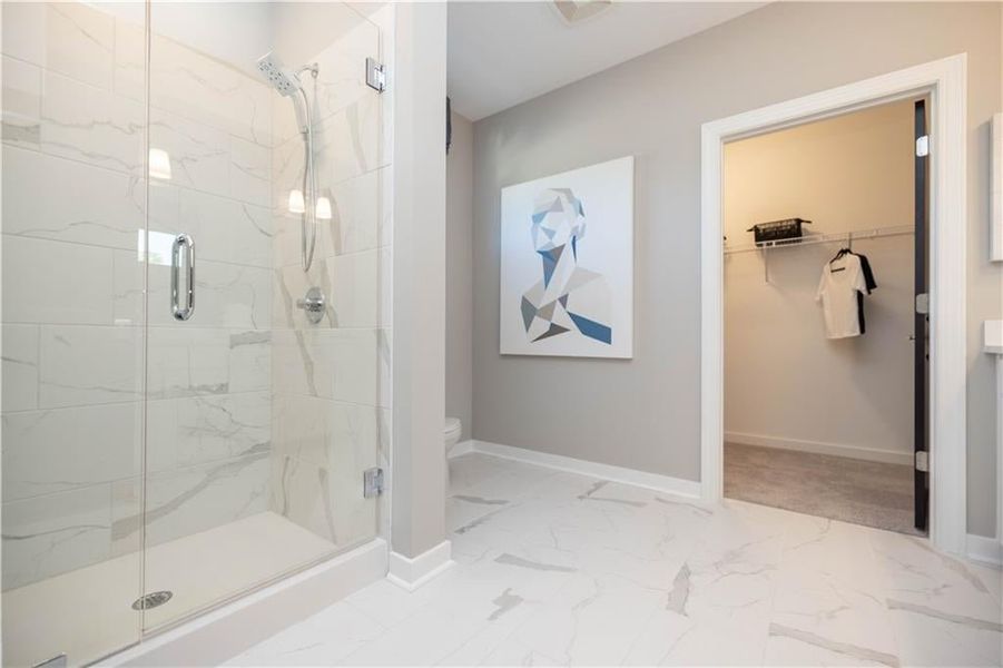 Bathroom featuring tile enclosed walk in oversized shower. Not actual home. Photos of Model Home.