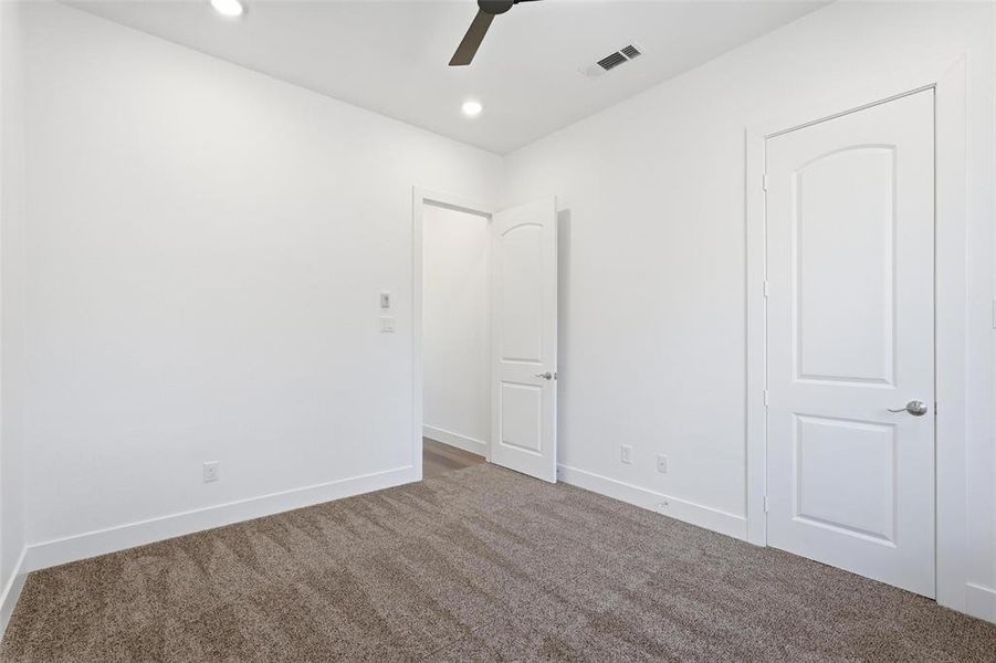 Rear secondary bedroom with seating/storage under window