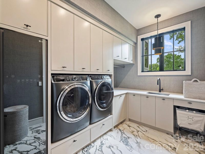 Laundry room off primary closet