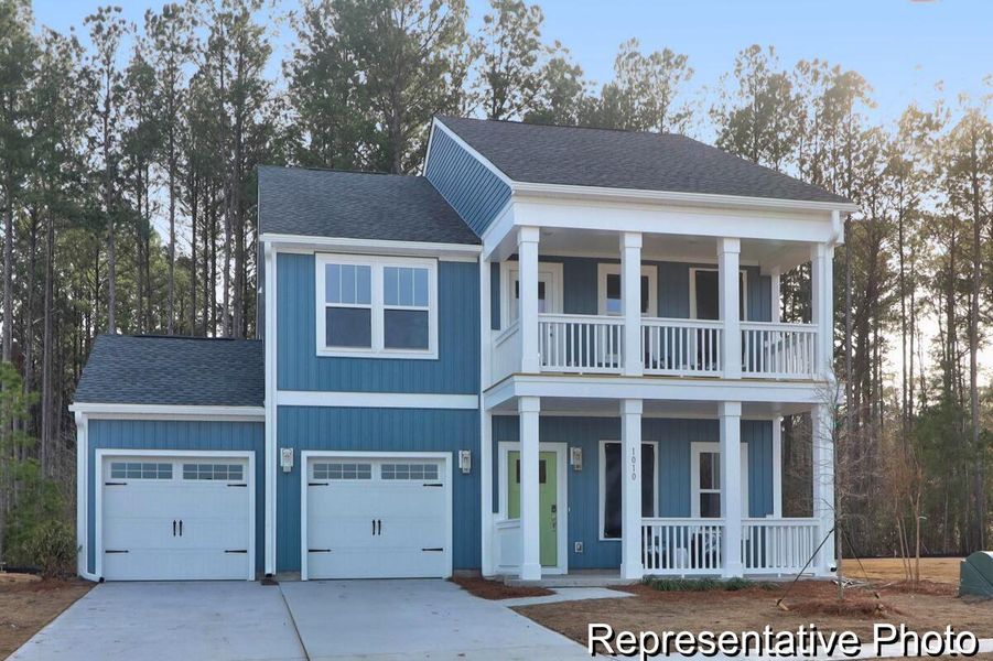 Front exterior of a new home in , Ravenel, SC, highlighting curb appeal (Image 22).