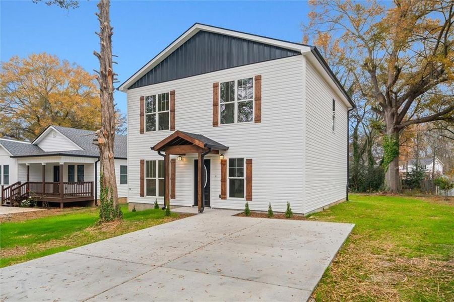 Front exterior of a new home in , Calhoun, GA, highlighting curb appeal (Image 1).