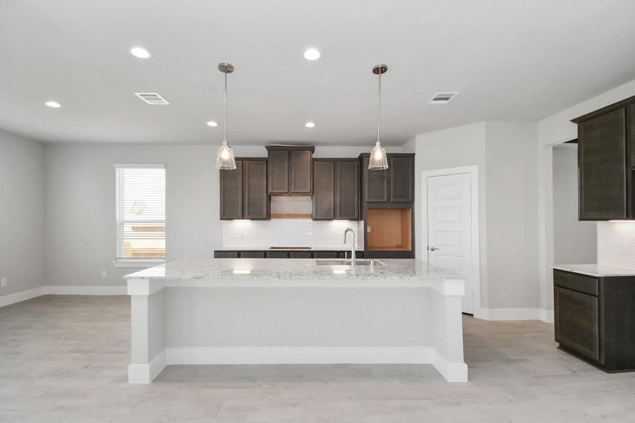 Sample photo of completed home with similar floor plan. Actual colors and selections may vary.