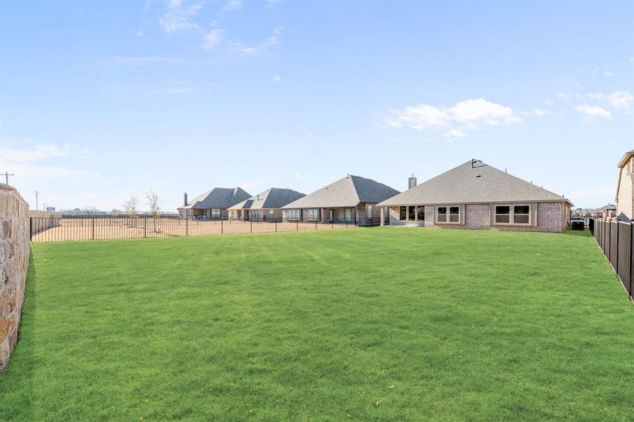 Exterior details and patio area of a home in Abe's Landing, Granbury (Image 26).