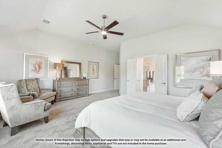 Spacious master bedroom with ceiling fan, carpet, seating area, dresser, and ensuite bathroom doorway. Spacious master bedroom with ceiling fan, carpet, seating area, dresser, and ensuite bathroom doorway.
