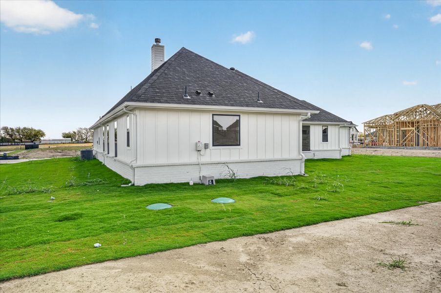Front exterior of a new home in Paloma Ranches, Justin, TX, highlighting curb appeal (Image 18). Front exterior of a new home in Paloma Ranches, Justin, TX, highlighting curb appeal (Image 18).