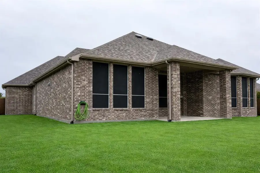Exterior details and patio area of a home in , Fate (Image 3).