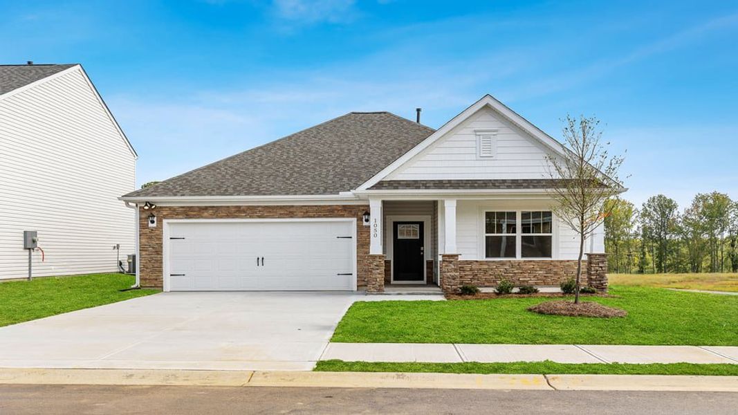 Front exterior of a new home in Hunters Ridge, Woodruff, SC, highlighting curb appeal (Image 1). Front exterior of a new home in Hunters Ridge, Woodruff, SC, highlighting curb appeal (Image 1).
