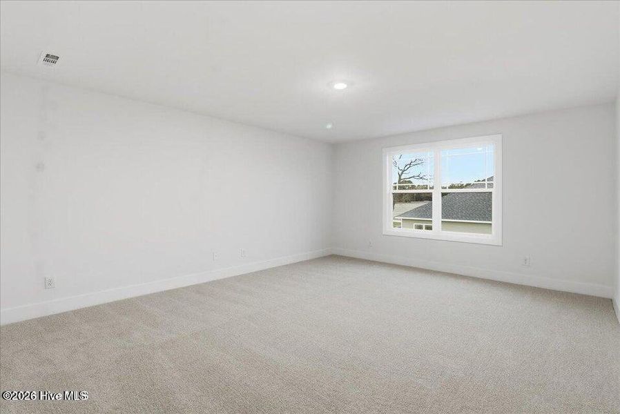 Spacious, unfurnished interior of a new home in Wood Creek Landing, Leland (Image 29).