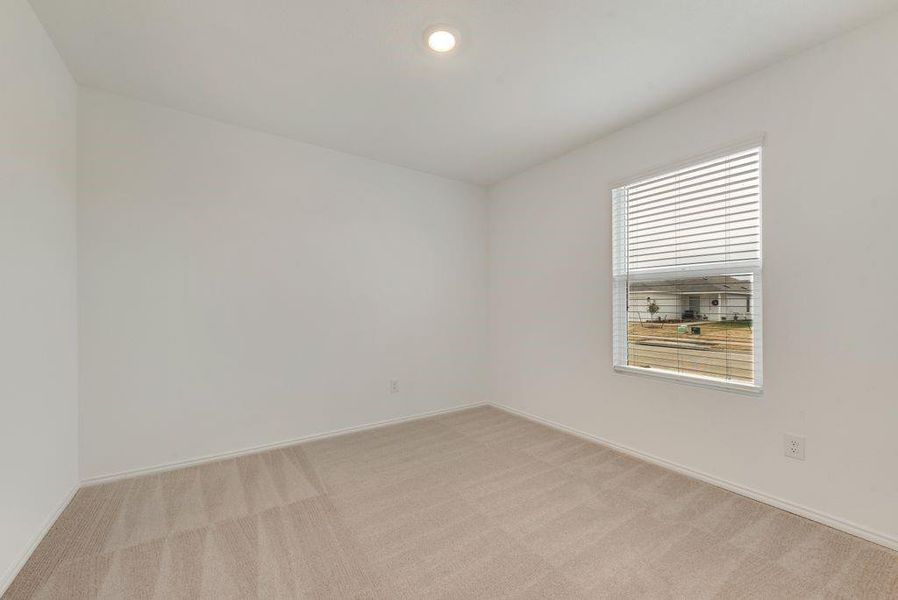 Unfurnished room with recessed lighting, light colored carpet, and baseboards