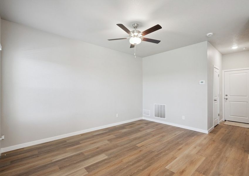 The family room is spacious with a ceiling fan. The family room is spacious with a ceiling fan.