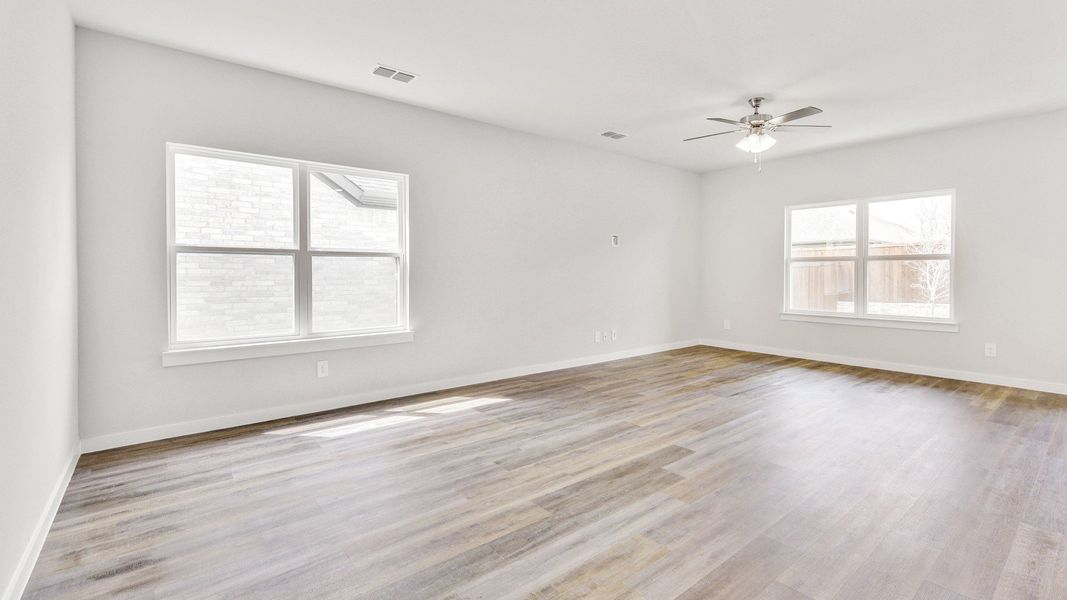 Representative furnished interior of a home built from the Meyerson by Brightland Homes in Sunterra, Katy (Image 7).