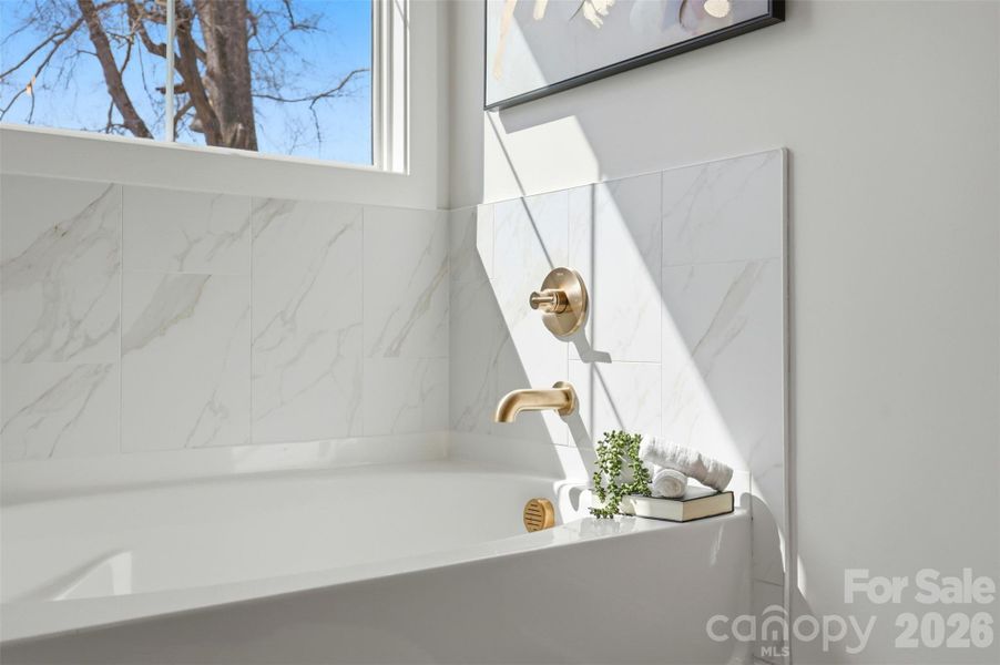 ensuite bathroom- tiled bath, frameless shower, shiplap dual vanities