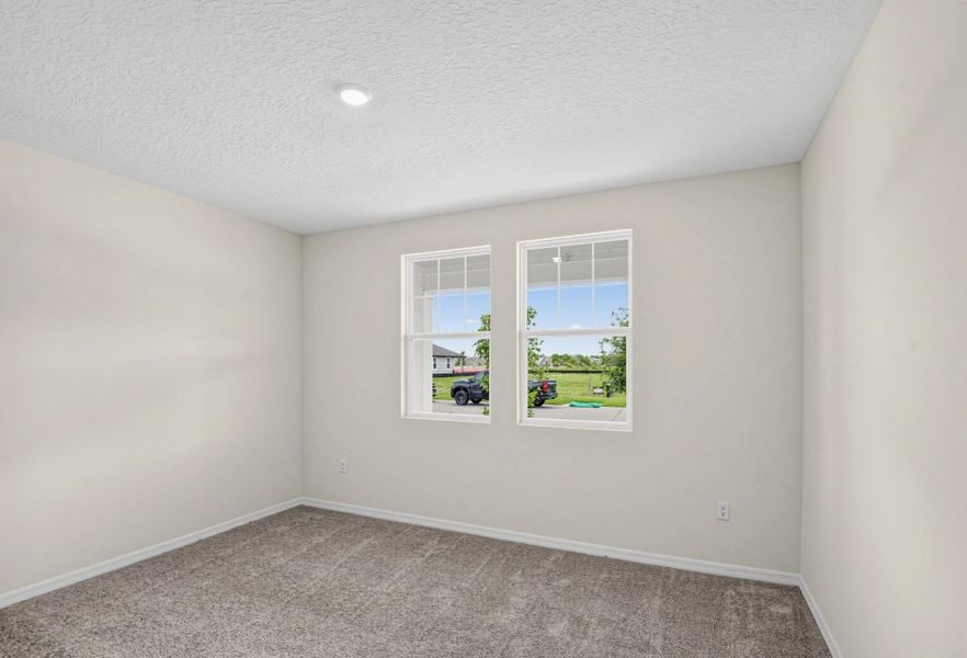 Spacious, unfurnished interior of a new home in Ardisia Park, New Smyrna Beach (Image 23).