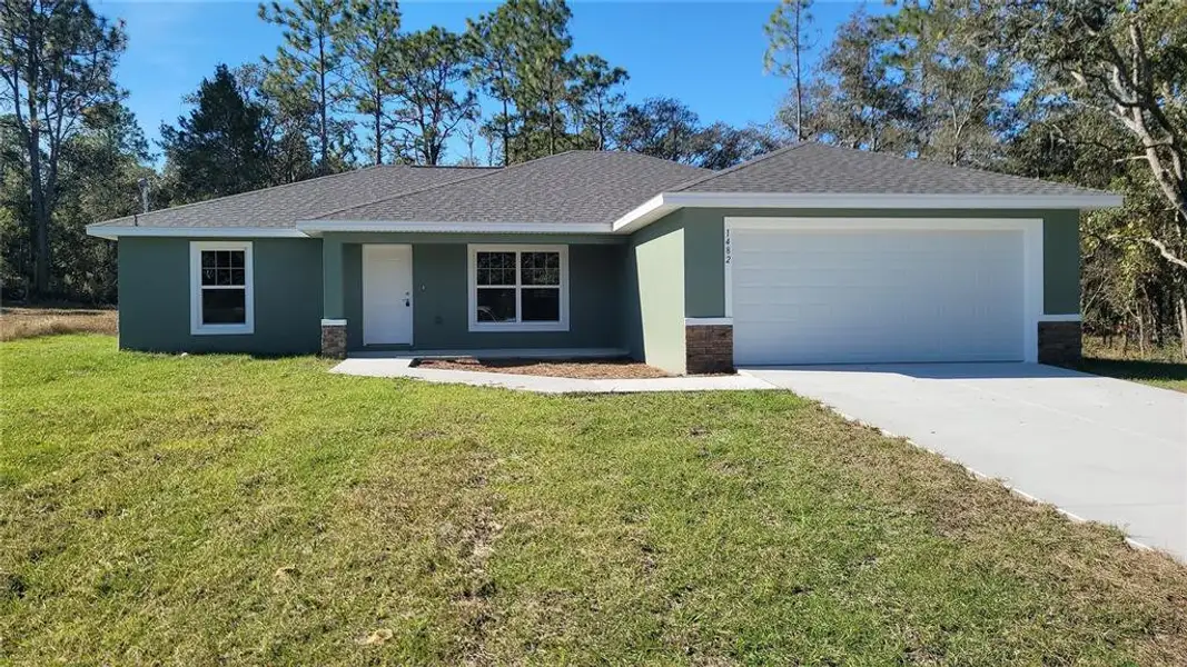 Front exterior of a new home in , Dunnellon, FL, highlighting curb appeal (Image 1). Front exterior of a new home in , Dunnellon, FL, highlighting curb appeal (Image 1).