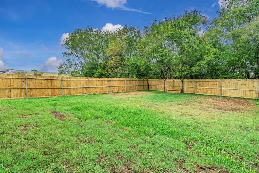 Front exterior of a new home in , Greenville, TX, highlighting curb appeal (Image 19). Front exterior of a new home in , Greenville, TX, highlighting curb appeal (Image 19).