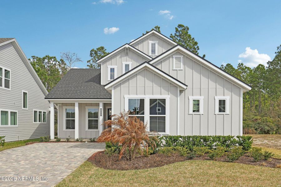 Front exterior of a new home in Middlebourne, St. Johns, FL, highlighting curb appeal (Image 27). Front exterior of a new home in Middlebourne, St. Johns, FL, highlighting curb appeal (Image 27).