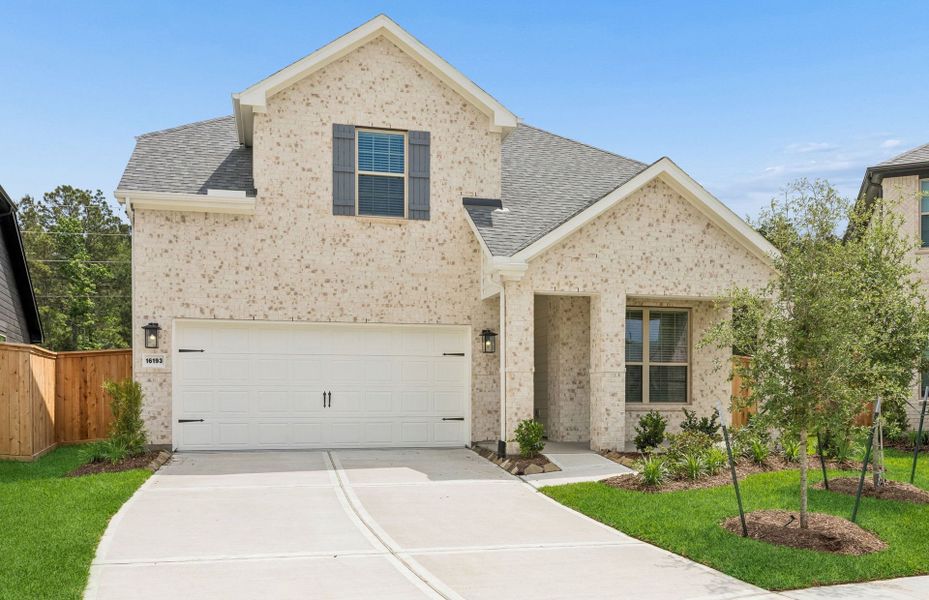 Front exterior of a new home in Mavera, Conroe, TX, highlighting curb appeal (Image 2). Front exterior of a new home in Mavera, Conroe, TX, highlighting curb appeal (Image 2).