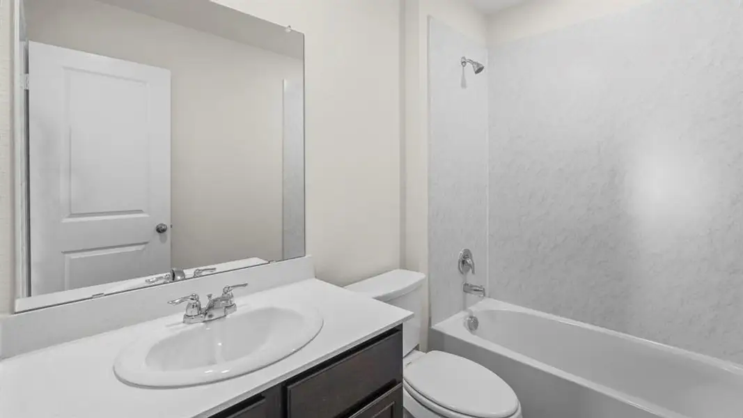 Bathroom with vanity and shower / washtub combination