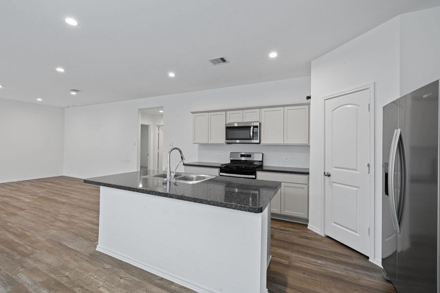 Kitchen is open to the family room. Great for entertaining.