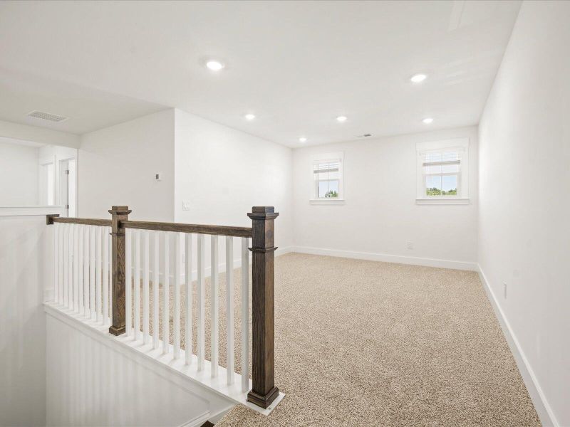 Spacious, unfurnished interior of a new home in The Coves at Lakes of Cane Bay II, Summerville (Image 21).
