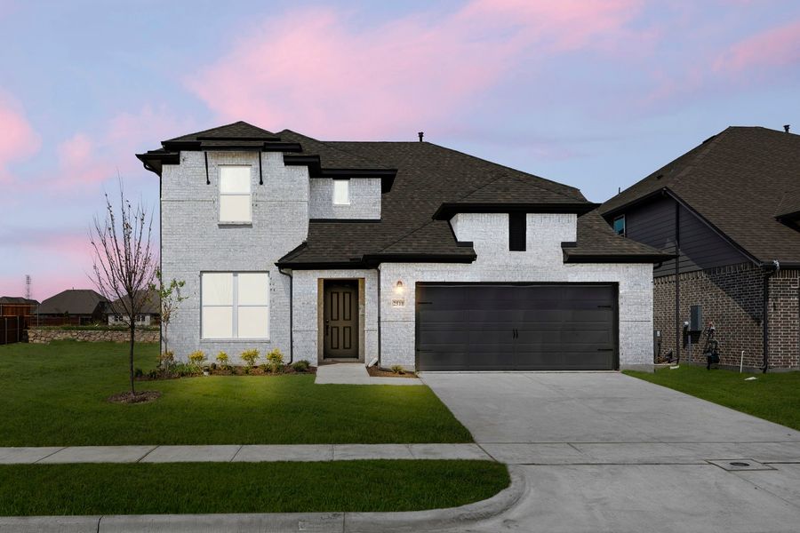 Front exterior of a new home in Walden Pond, Forney, TX, highlighting curb appeal (Image 20). Front exterior of a new home in Walden Pond, Forney, TX, highlighting curb appeal (Image 20).