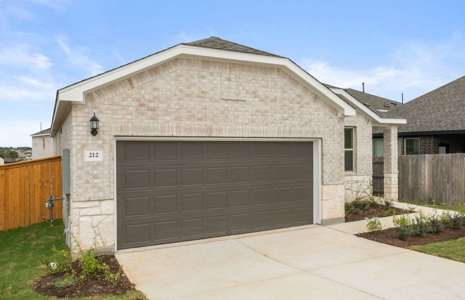 Front exterior of a new home in La Cima, San Marcos, TX, highlighting curb appeal (Image 20).
