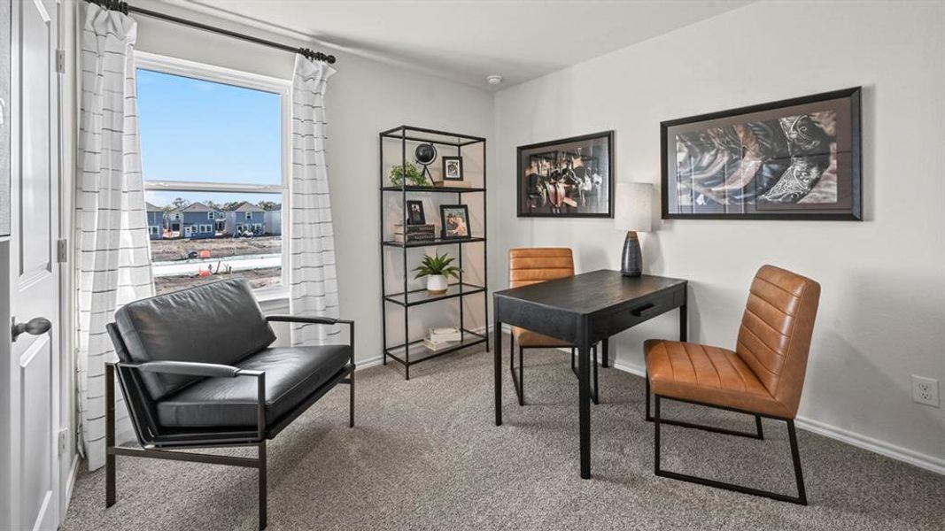 Home office featuring carpet and baseboards